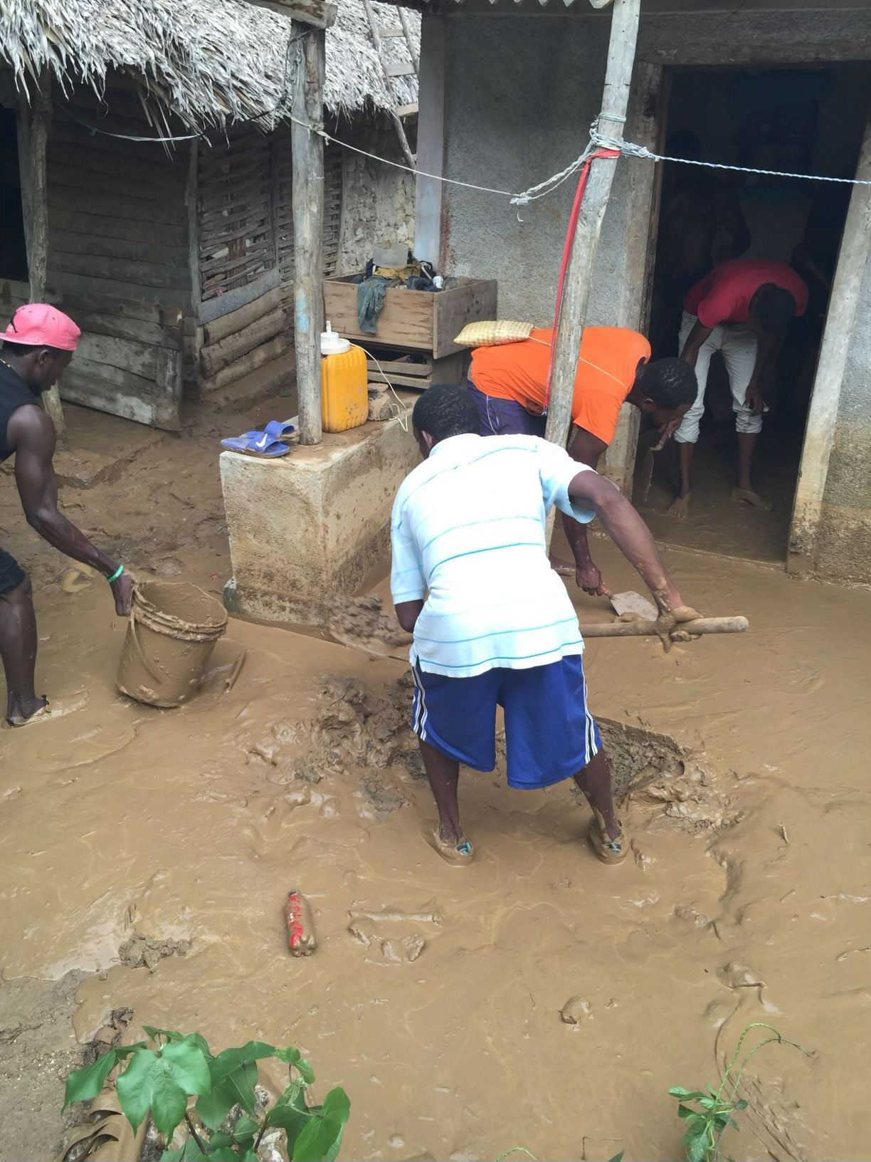 Men removing mud