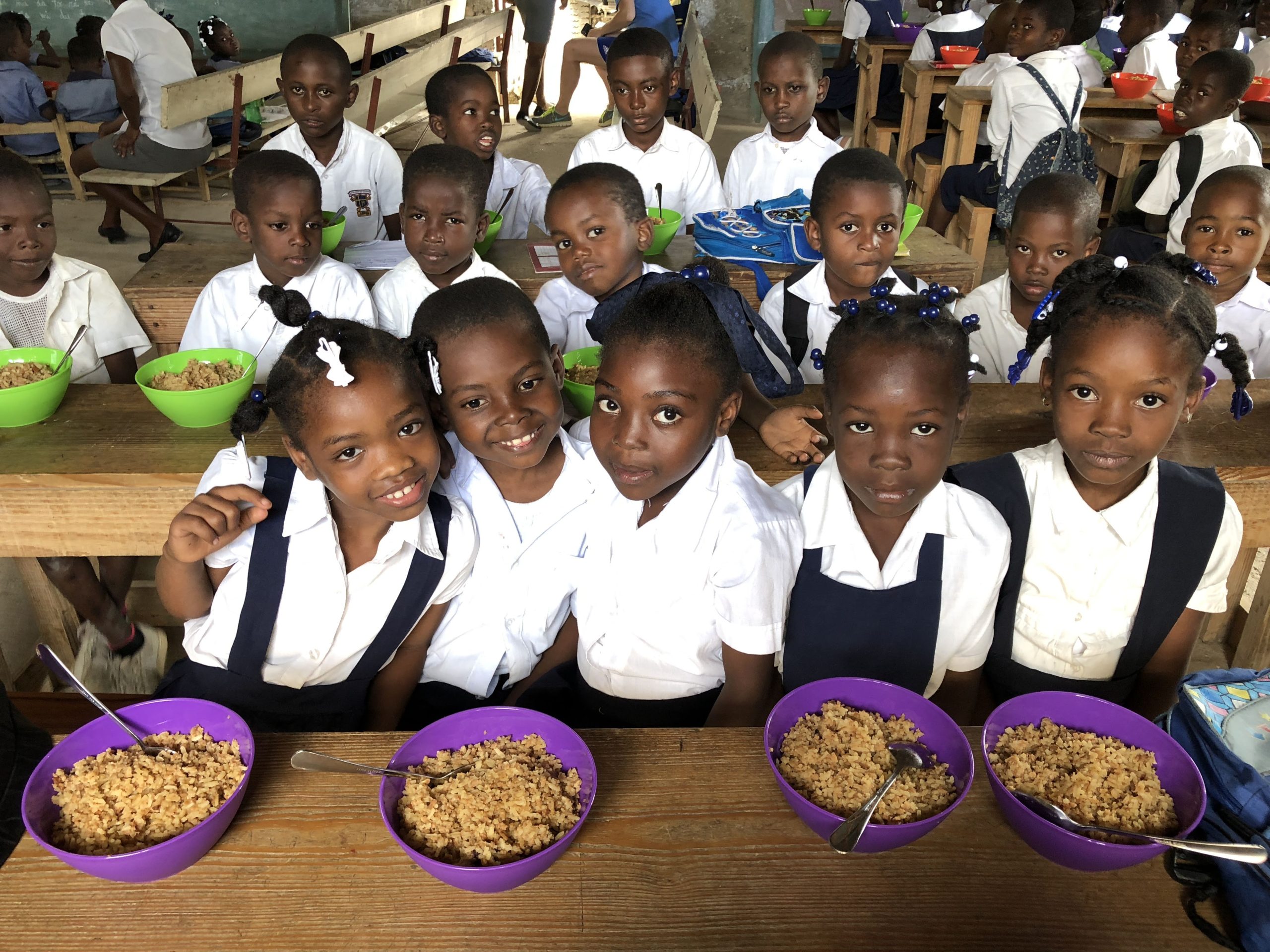 School kids smiling with food