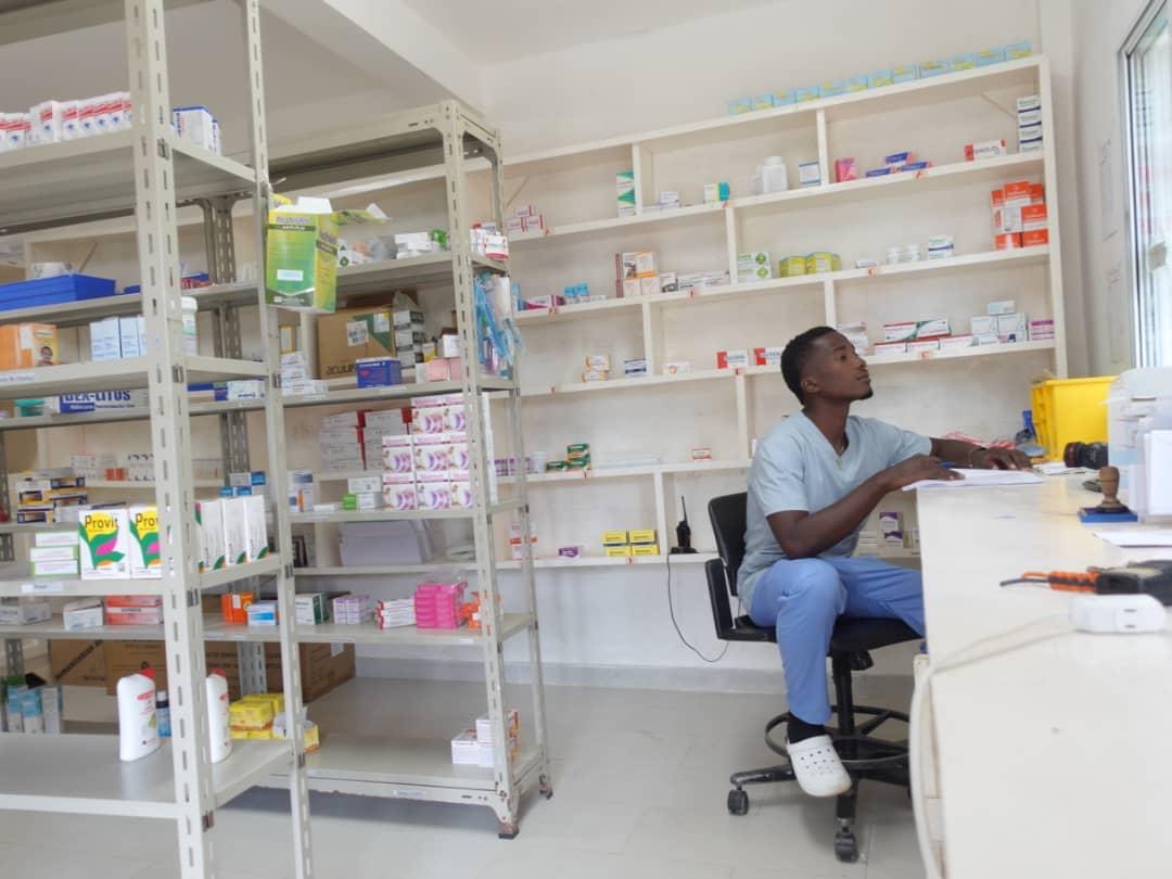 Man sitting in pharmacy